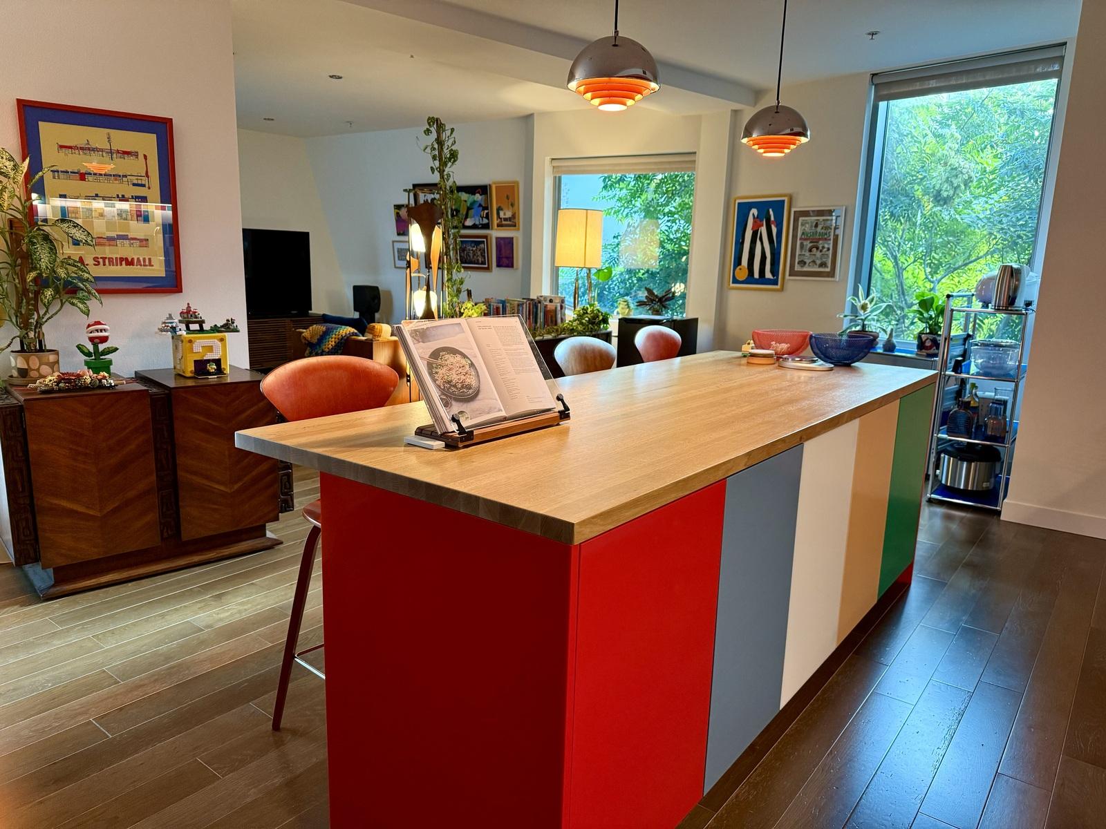 Kitchen island with colored fronts